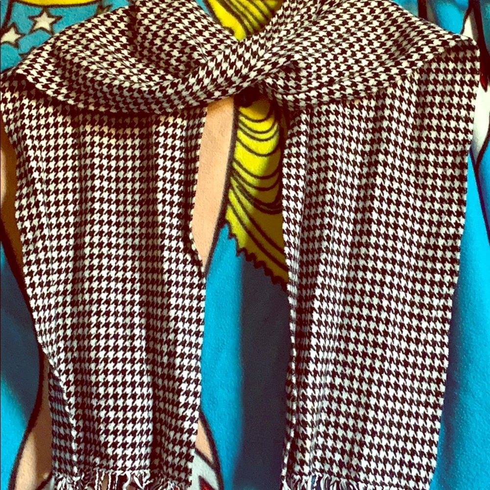 Black and white scarf with fringes at the end